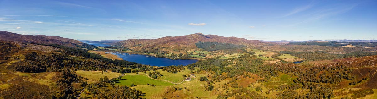Aerial drone panorama of Dunalastair Reservoir and the surrounding Highland Perthshire landscape near Kinloch Rannoch, where the Outlander Craigh na Dun scenes were filmed